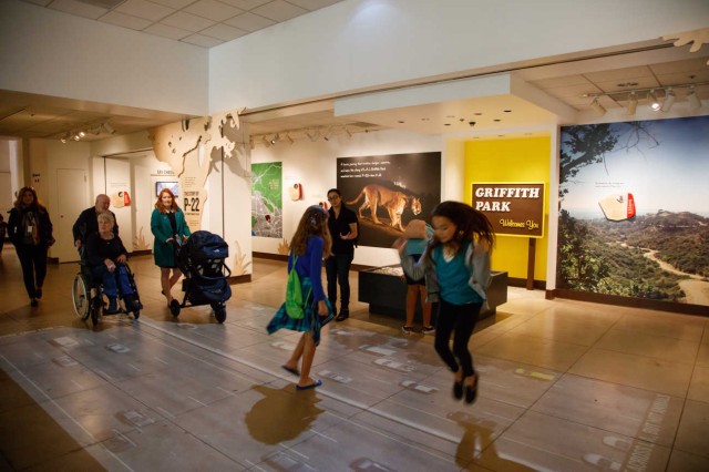 Children jumping on highway projection in P-22 exhibition