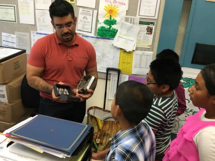 Miguel introduces students to camera trap technology