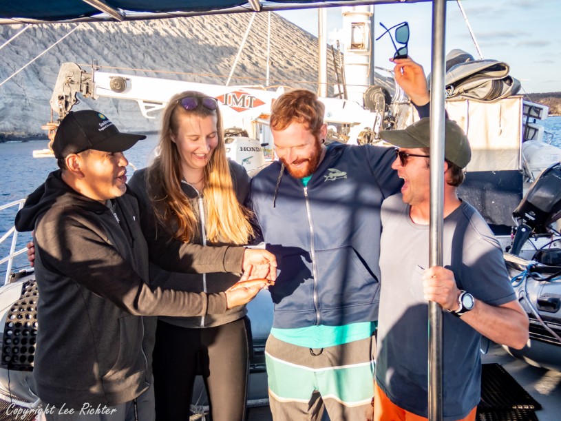 Dr. Carlos Sanchez, Ellie Place, Ben Frable, William Ludt - holding & celebrating the new species holotype of Halichoeres sanchezi,  Tailspot wrasse, on the deck of a boat